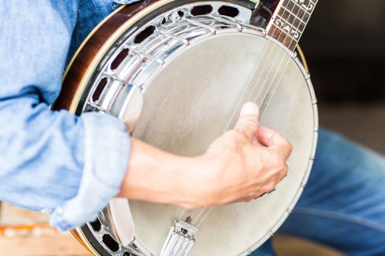 A man plays a banjo