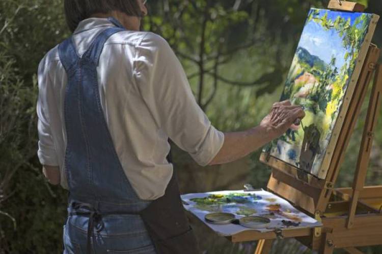 An artist painting outdoors