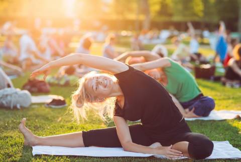 A woman stretched during the yoga festival A woman stretched during the yoga festival