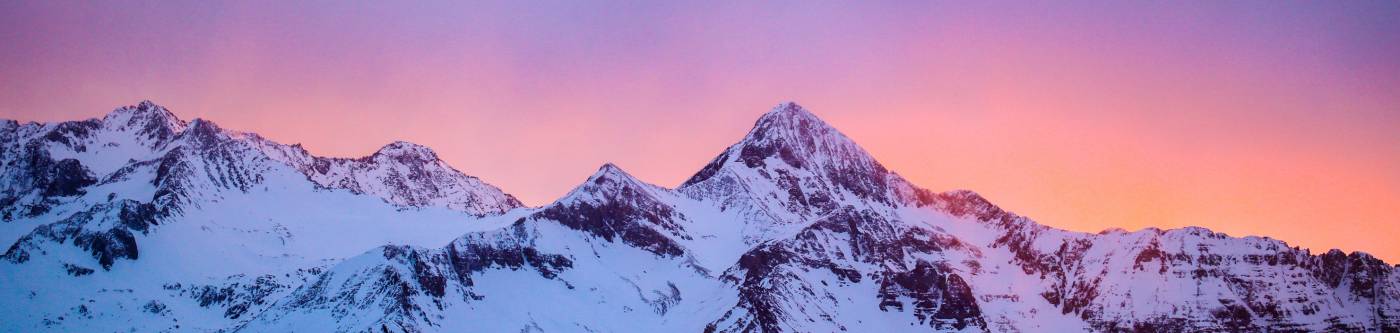 A view of mountains at sunset